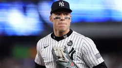Aaron Judge #99 of the New York Yankees jogs in at the end of the inning after catching a ball hit off the bat of Freddie Freeman #5 of the Los Angeles Dodgers at the wall during the fourth inning of Game Five of the 2024 World Series at Yankee Stadium on October 30, 2024 in the Bronx borough of New York City.