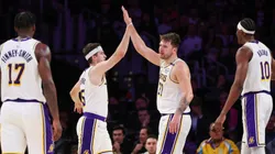 Luka Doncic #77 of the Los Angeles Lakers high-fives Austin Reaves #15 in the second half against the Phoenix Suns at Crypto.com Arena on March 16, 2025 in Los Angeles, California.