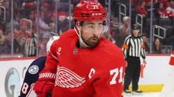 Dylan Larkin #71 of the Detroit Red Wings controls the puck in front of Zach Werenski #8 of the Columbus Blue Jackets during the second period at Little Caesars Arena on February 27, 2025 in Detroit, Michigan.