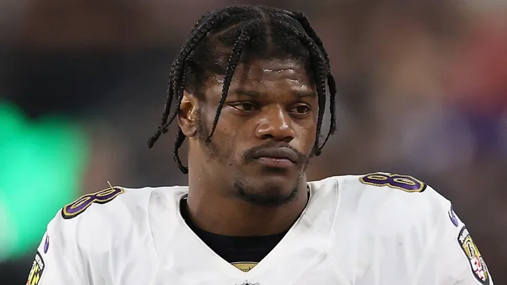 Quarterback Lamar Jackson #8 of the Baltimore Ravens holds a Microsoft surface on the sidelines during the NFL game at Allegiant Stadium on September 13, 2021 in Las Vegas, Nevada. The Raiders defeated the Ravens 33-27 in overtime.