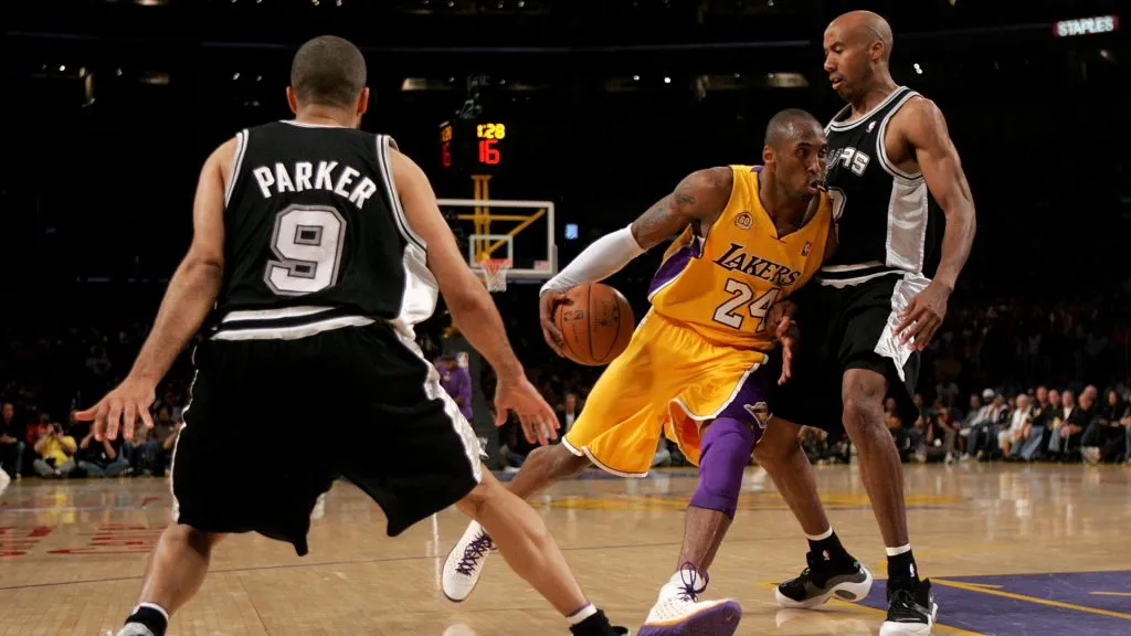 Kobe Bryant #24 drives to the basket between Bruce Bowen #12 and Tony Parker #9 in Game Two of the Western Conference Finals during the 2008 NBA Playoffs. (Jeff Gross/Getty Images)