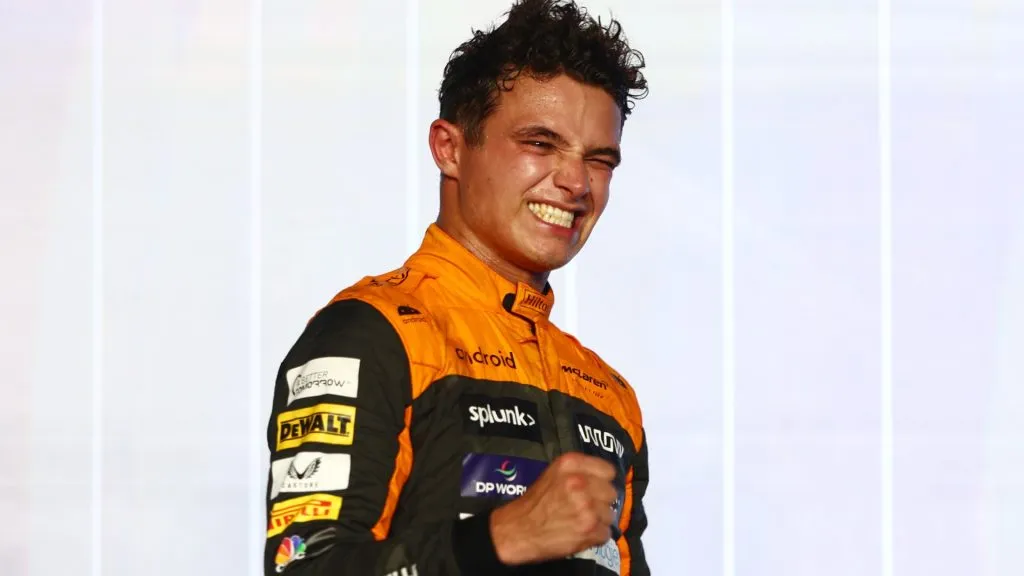 Third placed Lando Norris of Great Britain and McLaren celebrates on the podium during the F1 Grand Prix of Qatar at Lusail International Circuit on October 08, 2023. (Source: Clive Rose/Getty Images)