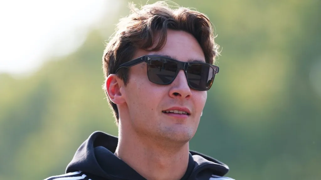 George Russell looks up