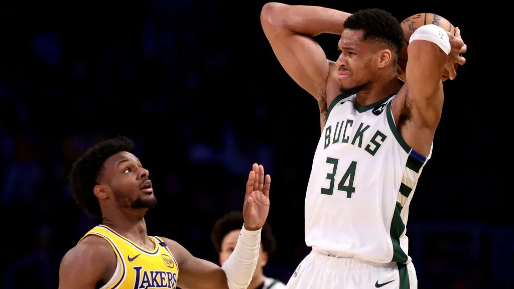 Giannis Antetokounmpo #34 of the Milwaukee Bucks looks to pass the ball against Bronny James #9 of the Los Angeles Lakers. (Katelyn Mulcahy/Getty Images)