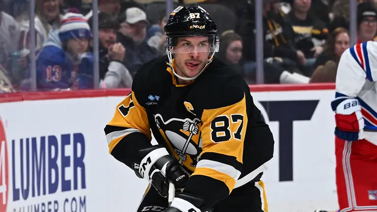 Sidney Crosby #87 of the Pittsburgh Penguins skates with the puck in the third period during the game against the New York Rangers at PPG PAINTS Arena on February 23, 2025 in Pittsburgh, Pennsylvania.