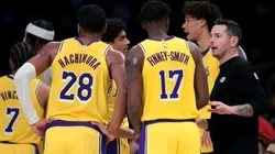 Head coach JJ Redick of the Los Angeles Lakers speaks with Dorian Finney-Smith #17 and Rui Hachimura #28 after a timeout during a 117-96 Lakers win over the Boston Celtics.
