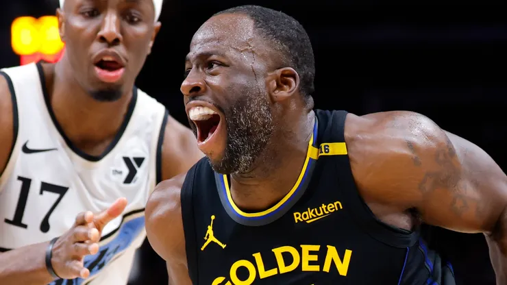 Draymond Green #23 of the Golden State Warriors drives against Onyeka Okongwu #17 of the Atlanta Hawks during the third quarter at State Farm Arena on March 22, 2025 in Atlanta, Georgia.