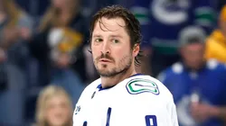 J.T. Miller #9 of the Vancouver Canucks looks on prior to the game against the Nashville Predators at Bridgestone Arena on January 29, 2025 in Nashville, Tennessee.
