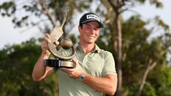 Viktor Hovland of Norway poses with the trophy after putting in to win on the 18th green during the final round of the Valspar Championship 2025 at Innisbrook Resort and Golf Club on March 23, 2025 in Palm Harbor, Florida.