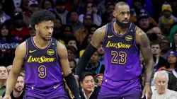 Bronny James #9 stands by LeBron James #23 of the Los Angeles Lakers during the second half against the Philadelphia 76ers at the Wells Fargo Center on January 28, 2025 in Philadelphia, Pennsylvania.