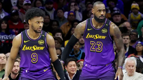 Bronny James #9 stands by LeBron James #23 of the Los Angeles Lakers during the second half against the Philadelphia 76ers at the Wells Fargo Center on January 28, 2025 in Philadelphia, Pennsylvania.