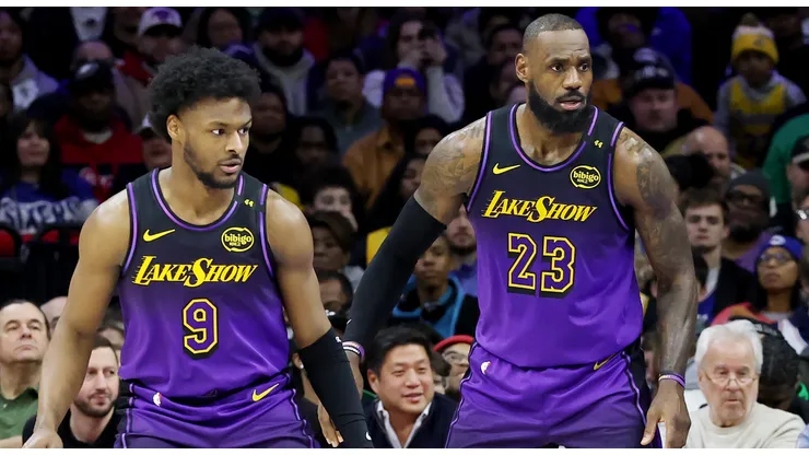 Bronny James #9 stands by LeBron James #23 of the Los Angeles Lakers during the second half against the Philadelphia 76ers at the Wells Fargo Center on January 28, 2025 in Philadelphia, Pennsylvania.