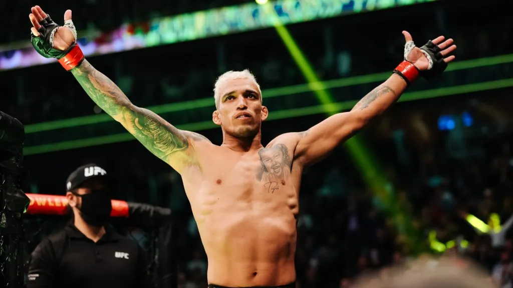 Charles Oliveira of Brazil enters the octagon for his lightweight title fight against Dustin Poirier during the UFC 269 event at T-Mobile Arena on December 11, 2021. (Source: Carmen Mandato/Getty Images)