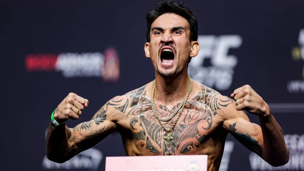 Max Holloway poses on the scale during the UFC 276 ceremonial weigh-in at T-Mobile Arena on July 01, 2022. (Source: Carmen Mandato/Getty Images)