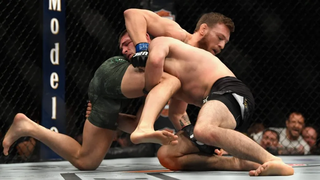 Conor McGregor of Ireland tackles Khabib Nurmagomedov of Russia in their UFC lightweight championship bout during the UFC 229 event inside T-Mobile Arena on October 6, 2018. (Source: Harry How/Getty Images)