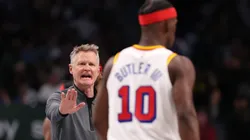 Head coach Steve Kerr of the Golden State Warriors talks to Jimmy Butler #10.