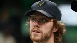 Boston Bruins players David Pastrnak and Charlie McAvoy attend Game One of the Eastern Conference First Round Playoffs between the Boston Celtics and the Atlanta Hawks at TD Garden on April 15, 2023 in Boston, Massachusetts.