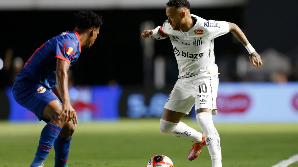 Neymar (R) of Santos drives the ball against Matheus Fernandes of Red Bull Bragantino during a match between Santos and Red Bull Bragantino. (Miguel Schincariol/Getty Images)