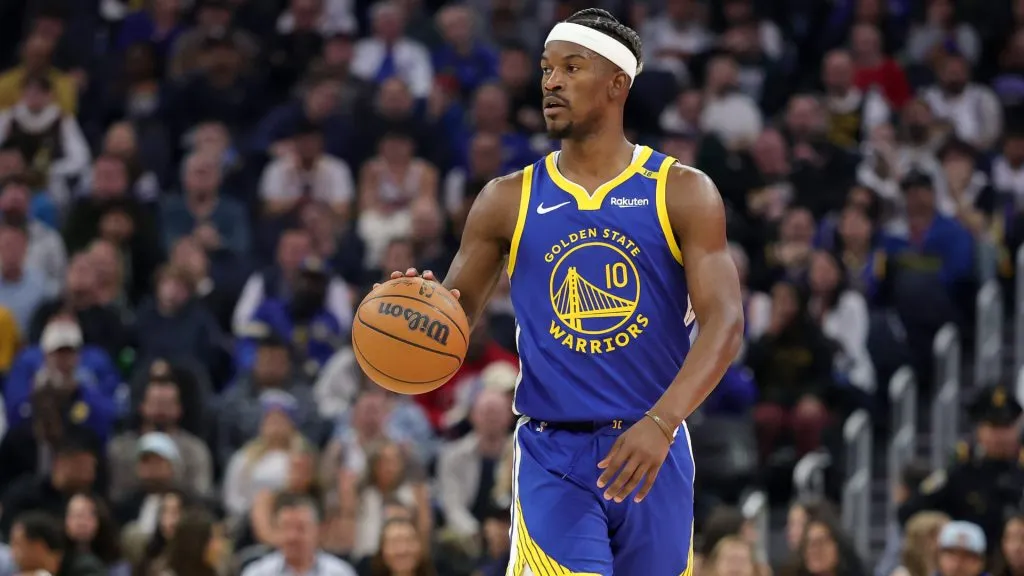 Jimmy Butler III #10 of the Golden State Warriors dribbles the ball against the Portland Trail Blazers at Chase Center.