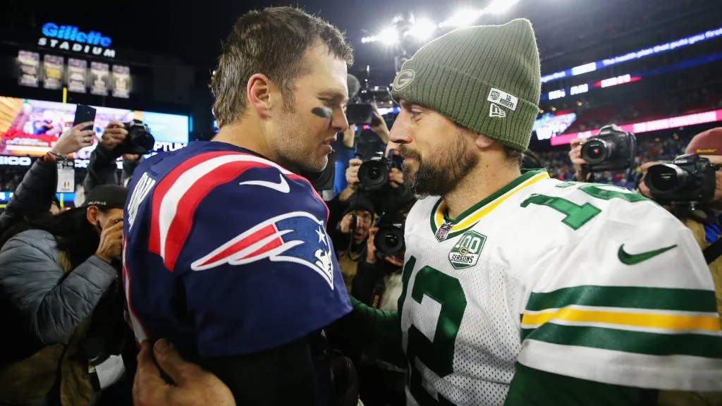 Tom Brady #12 of the New England Patriots talks with Aaron Rodgers #12 of the Green Bay Packers after the Patriots defeated the Packers 31-17 in 2018. (Source: Maddie Meyer/Getty Images)