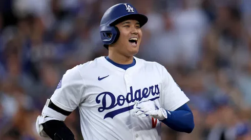 Shohei Ohtani #17 of the Los Angeles Dodgers reacts to his solo home run, his 42nd of the season, to take a 1-0 lead over the Baltimore Orioles in 2024.
