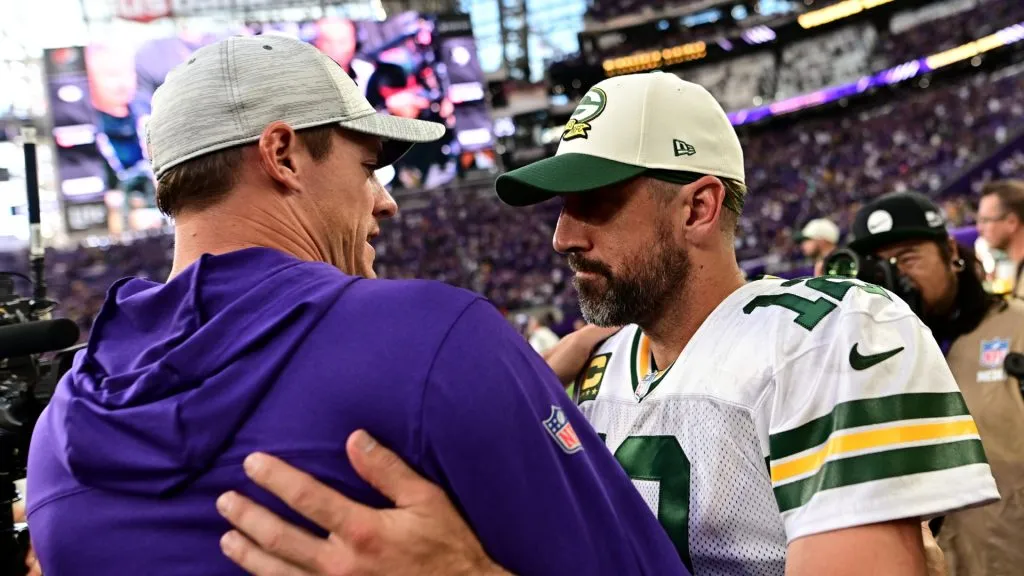 Head coach Kevin O'Connell of the Minnesota Vikings embraces Aaron Rodgers #12 of the Green Bay Packers after the game at U.S. Bank Stadium on September 11, 2022 in Minneapolis, Minnesota.