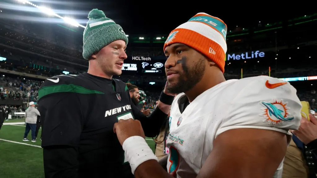 Tim Boyle #7 of the New York Jets congratulates Tua Tagovailoa #1 of the Miami Dolphins after the game at MetLife Stadium on November 24, 2023 in East Rutherford, New Jersey.