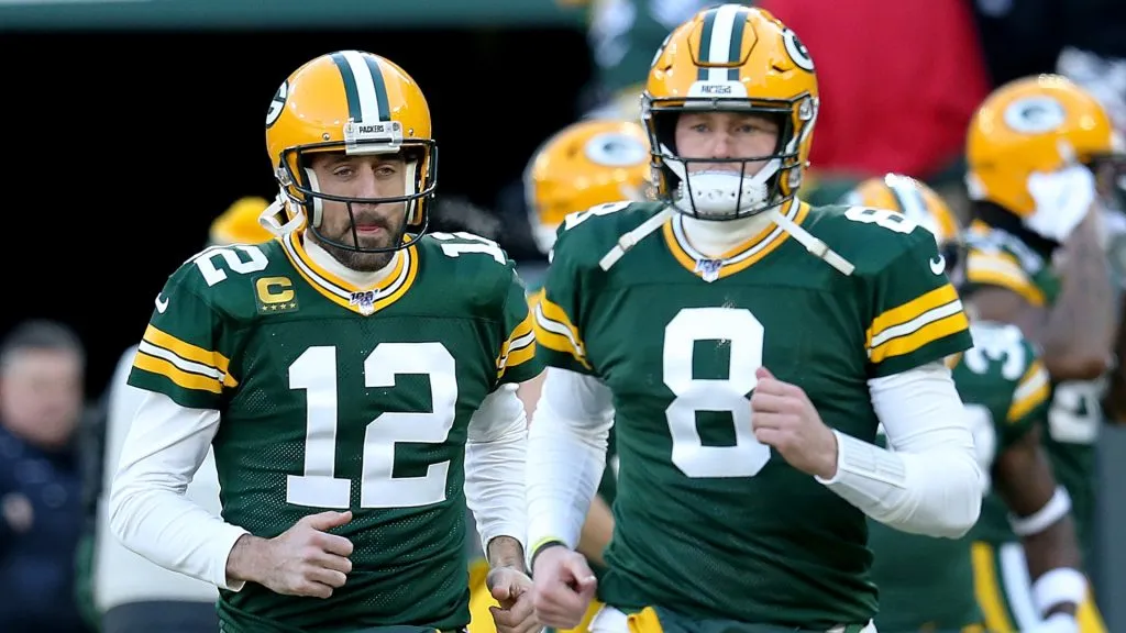 Quarterbacks Aaron Rodgers #12 and Tim Boyle #8 of the Green Bay Packers warm up before the game against the Chicago Bears at Lambeau Field on December 15, 2019 in Green Bay, Wisconsin.
