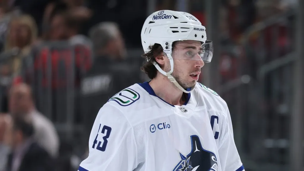 Quinn Hughes #43 of the Vancouver Canucks reacts in the third period against the New Jersey Devils at Prudential Center on March 24, 2025 in Newark, New Jersey. The Vancouver Canucks defeated the New Jersey Devils 4-3 after an overtime period and a shootout.
