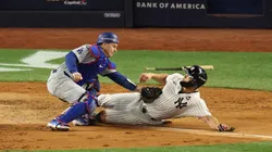 Will Smith #16 of the Los Angeles Dodgers tags out Giancarlo Stanton #27 of the New York Yankees in the fourth inning during Game Three of the 2024 World Series.