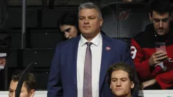 New Jersey Devils head coach Sheldon Keefe prepares to tend to the bench prior to the game against the Boston Bruins at Prudential Center on January 22, 2025 in Newark, New Jersey.