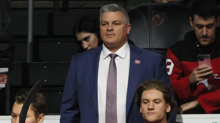 New Jersey Devils head coach Sheldon Keefe prepares to tend to the bench prior to the game against the Boston Bruins at Prudential Center on January 22, 2025 in Newark, New Jersey.