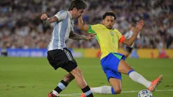 Rodrigo De Paul of Argentina shoots against Marquinhos of Brazil during the South of American FIFA World Cup 2026 Qualifier between Argentina and Brazil.