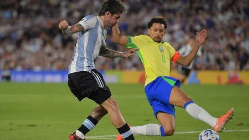 Rodrigo De Paul of Argentina shoots against Marquinhos of Brazil during the South of American FIFA World Cup 2026 Qualifier between Argentina and Brazil.