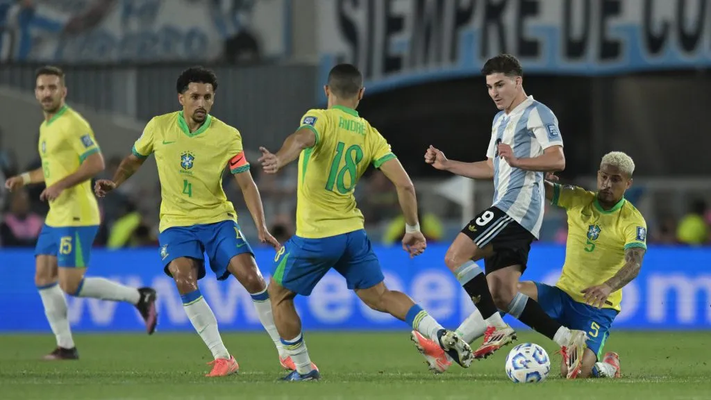 Julian Alvarez defends the ball against João Gomes, André and Marquinhos during the FIFA World Cup 2026 Qualifier between Argentina and Brazil. (Marcelo Endelli/Getty Images)