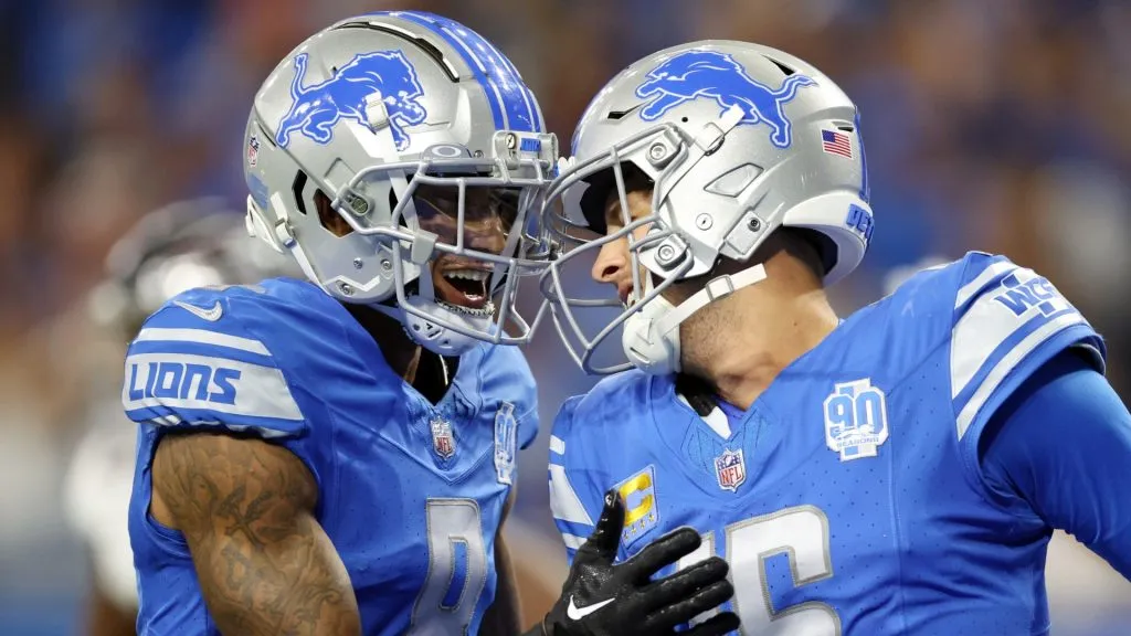 Jared Goff #16 celebrates after a fourth quarter touchdown with Josh Reynolds #8 of the Detroit Lions against the Atlanta Falcons at Ford Field on September 24, 2023 in Detroit, Michigan.