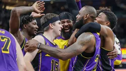 The Los Angeles Lakers celebrate with LeBron James #23 after a buzzer-beating tip-in to defeat the Indiana Pacers at Gainbridge Fieldhouse.
