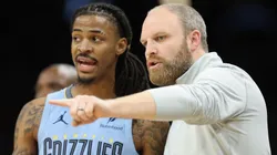 Head coach Taylor Jenkins (R) of the Memphis Grizzlies talks with Ja Morant #12 during the second half of the NBA game at Footprint Center on February 11, 2025 in Phoenix, Arizona.