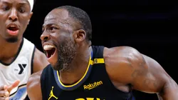Draymond Green #23 of the Golden State Warriors drives against Onyeka Okongwu #17 of the Atlanta Hawks