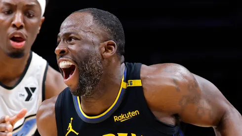 Draymond Green #23 of the Golden State Warriors drives against Onyeka Okongwu #17 of the Atlanta Hawks