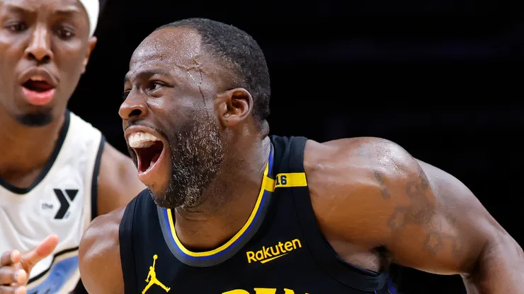 Draymond Green #23 of the Golden State Warriors drives against Onyeka Okongwu #17 of the Atlanta Hawks