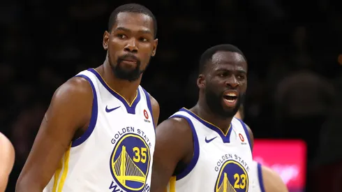 Draymond Green #23 of the Golden State Warriors celebrates with Kevin Durant #35 against the Cleveland Cavaliers during Game Three of the 2018 NBA Finals.