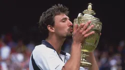 Goran Ivanisevic of Croatia kisses the winning trophy after winning the men's final of the Wimbledon Lawn Tennis Championship.