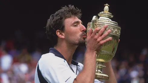 Goran Ivanisevic of Croatia kisses the winning trophy after winning the men's final of the Wimbledon Lawn Tennis Championship.