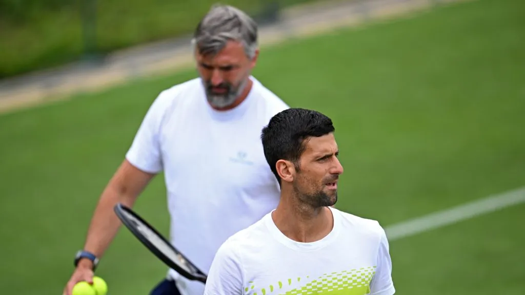 Novak Djokovic of Serbia looks on in front of Tennis Coach, Goran Ivanisevic, during a practice session ahead of The Championships ā Wimbledon 2023. (Shaun Botterill/Getty Images)