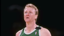 Forward Larry Bird of the Boston Celtics stands on the court during a game.