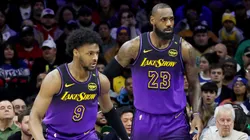 Bronny James #9 stands by LeBron James #23 of the Los Angeles Lakers during the 2024-25 season