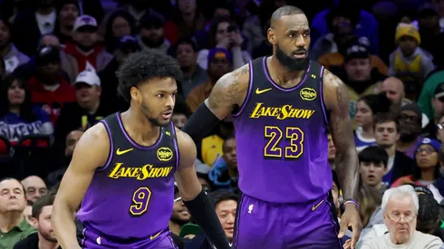 Bronny James #9 stands by LeBron James #23 of the Los Angeles Lakers during the 2024-25 season