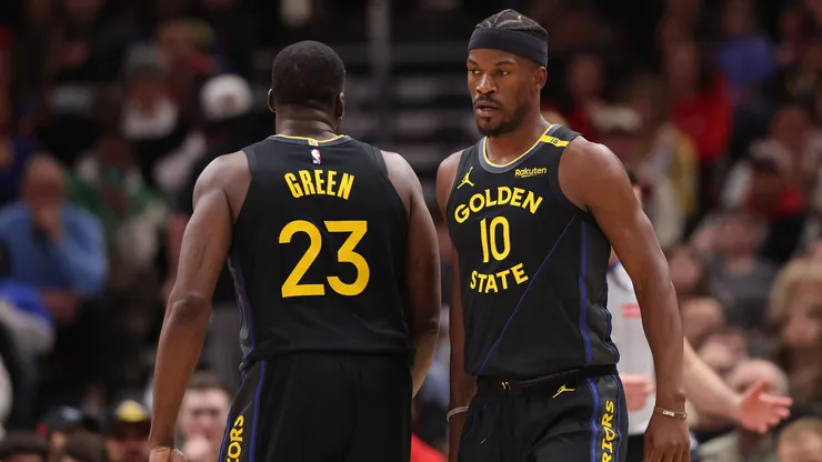 Draymond Green #23 and Jimmy Butler #10 of the Golden State Warriors look on against the Chicago Bulls during the second half at the United Center.
