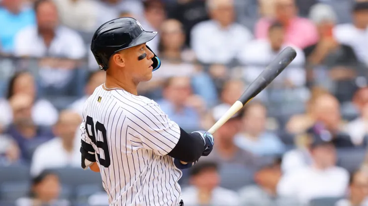 Aaron Judge #99 of the New York Yankees hits a grand slam home run in the third inning against the Milwaukee Brewers at Yankee Stadium on March 29, 2025 in New York City.